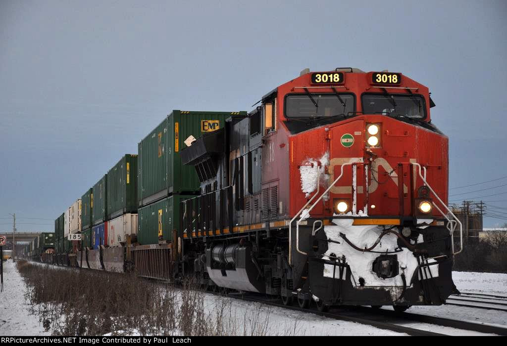 Intermodal cruises south past the yard